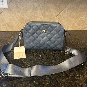 Le Bag Quilted Blue Crossbody Bag with Rose gold  accents .